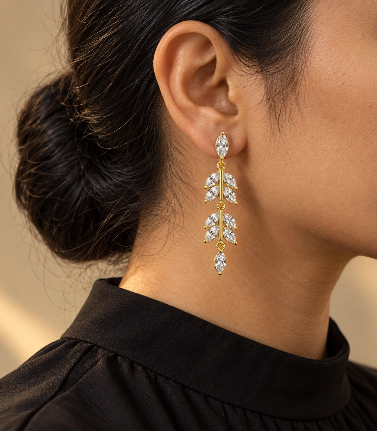 JIMIKI Marquise Crystal Leaf Drop Earring Pair in Gold tone, editorial model view #color_gold tone