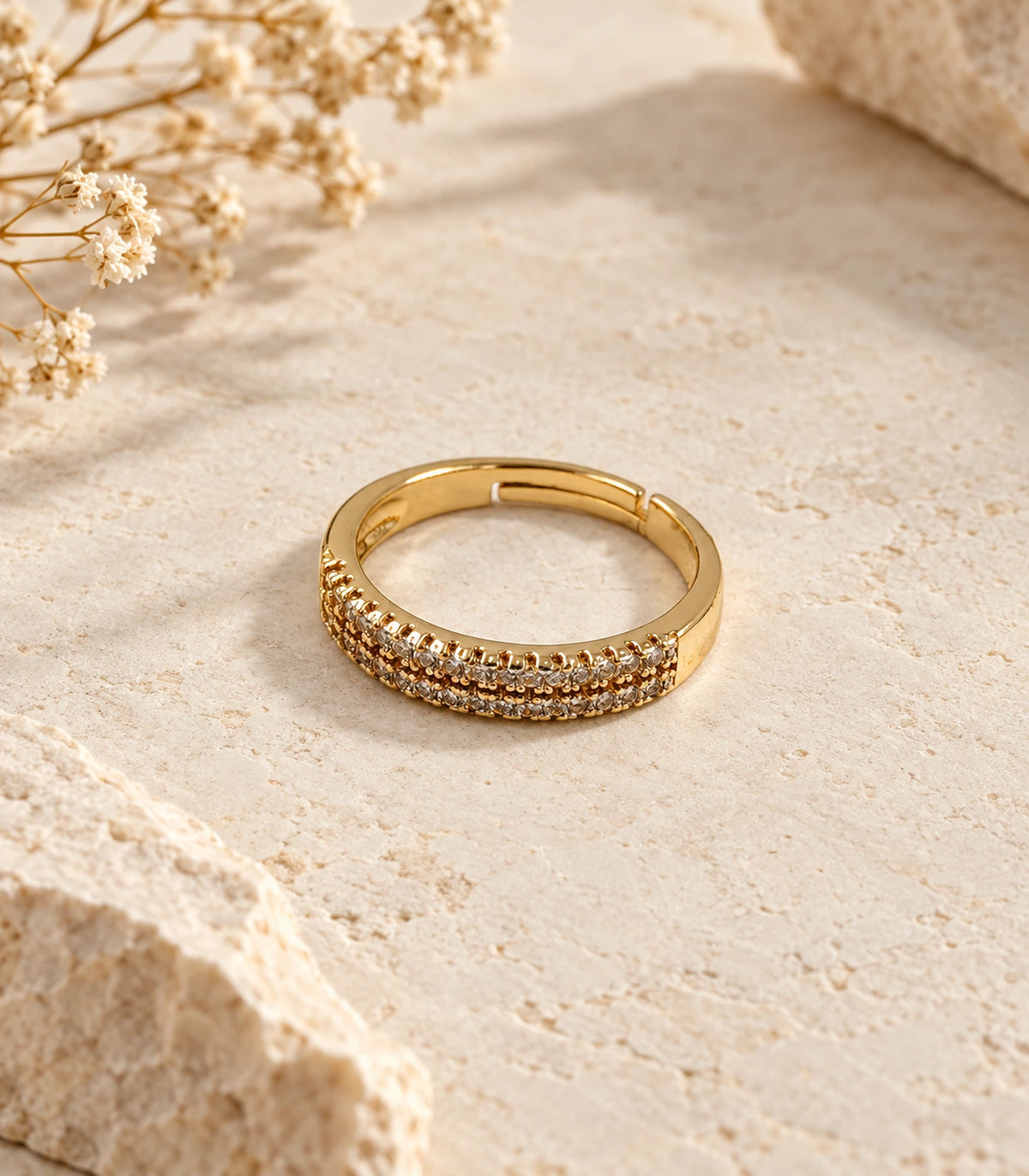 JIMIKI Gold Tone Multi Row Crystal Adjustable Ring in Gold Tone - editorial flatlay #color_gold-tone