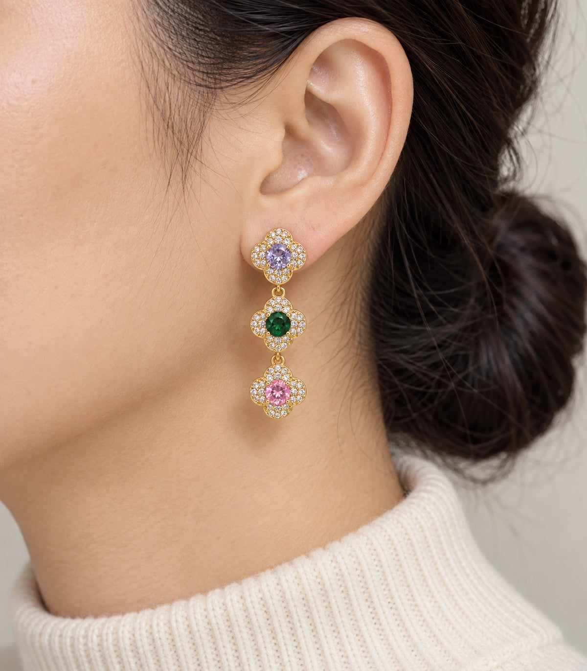 JIMIKI Gold Tone Multicolour Triple Clover Halo Drop Earring Pair in Gold tone / multicolour, model wearing view