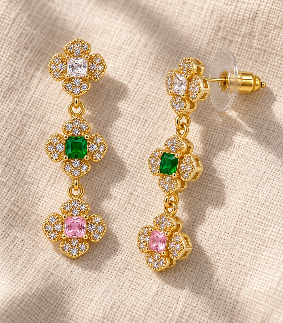 JIMIKI Triple Four Petal Flower Drop Earring Pair in Gold tone / multicolour, editorial flat lay #color_gold tone / multicolour