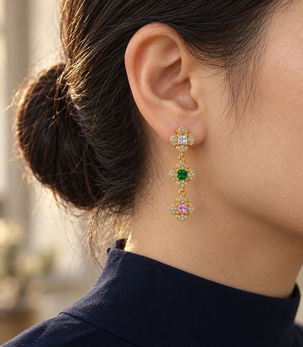 JIMIKI Triple Four Petal Flower Drop Earring Pair in Gold tone / multicolour, editorial model view #color_gold tone / multicolour