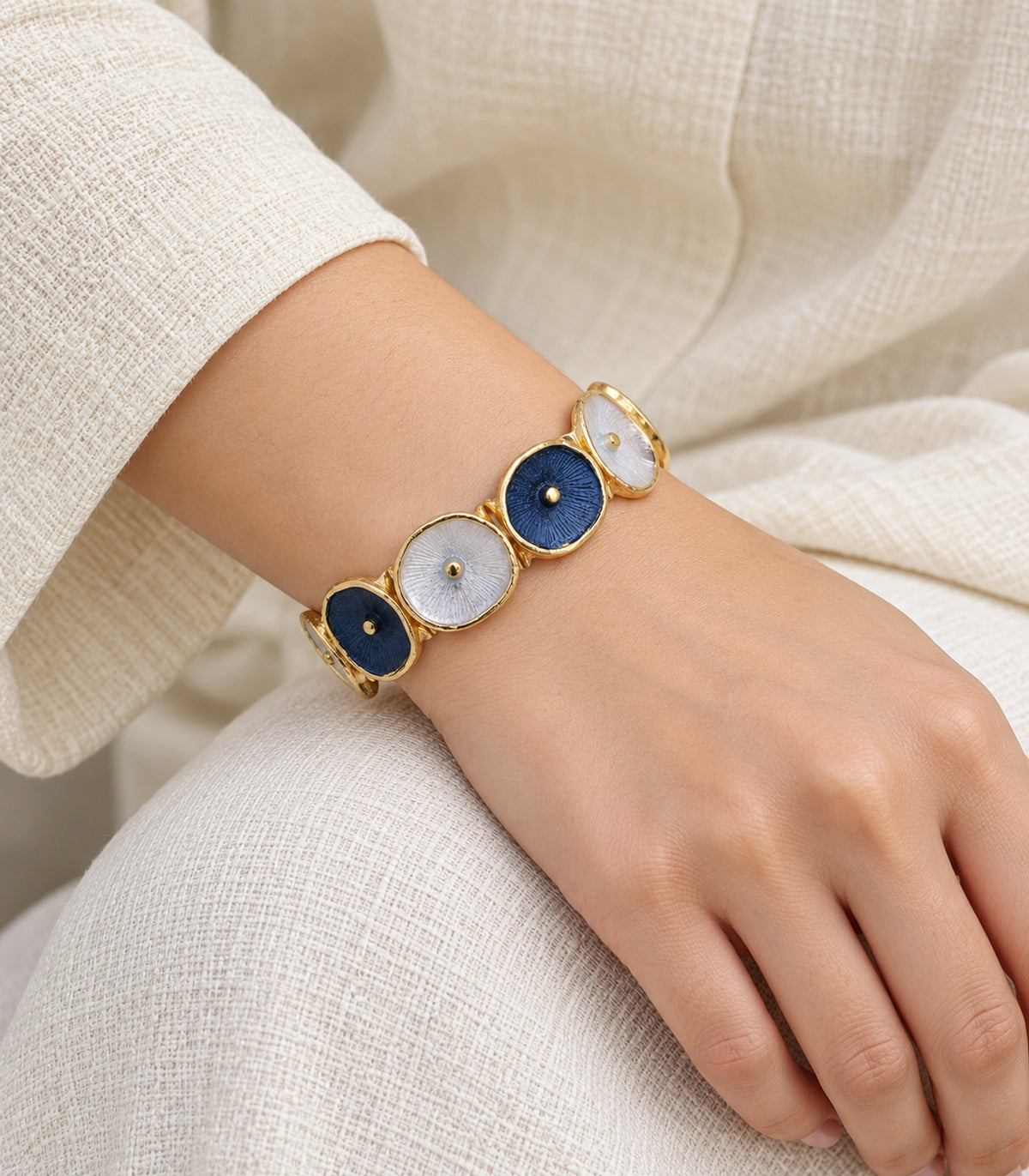 JIMIKI gold-tone navy and white oval disc bracelet — model
