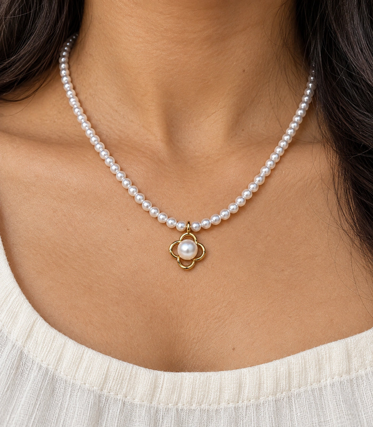 JIMIKI Gold Tone Open Clover Pearl Style Necklace in Gold tone / white, close-up detail
