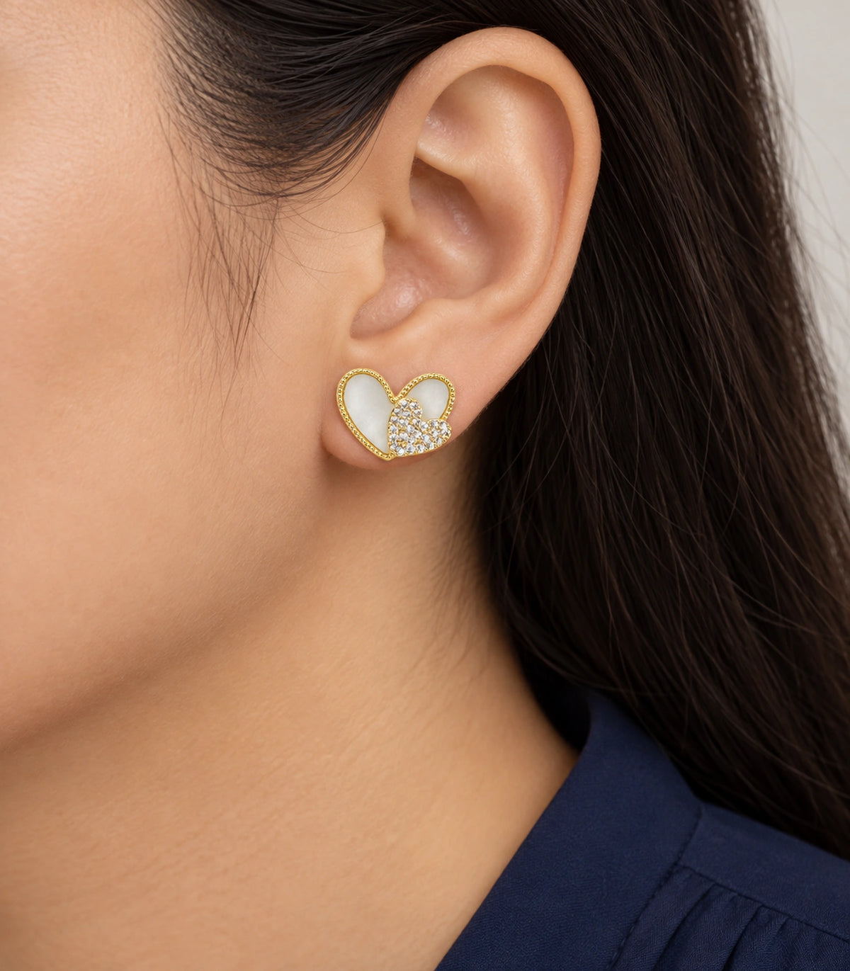 JIMIKI Open Heart Pave Heart Stud Earring Pair in Gold tone, model wearing view #color_gold tone