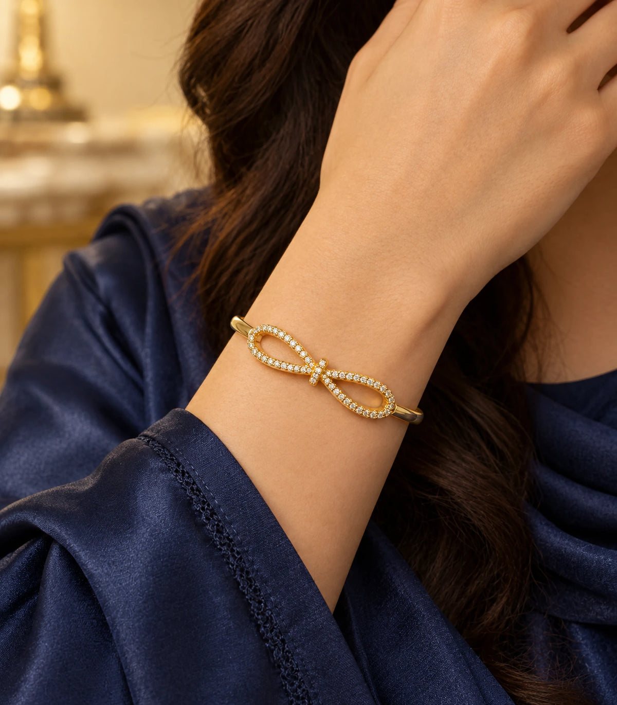 JIMIKI Gold-Tone Open Infinity Pavé Bangle — bangle styled with an outfit #color_gold-tone / clear