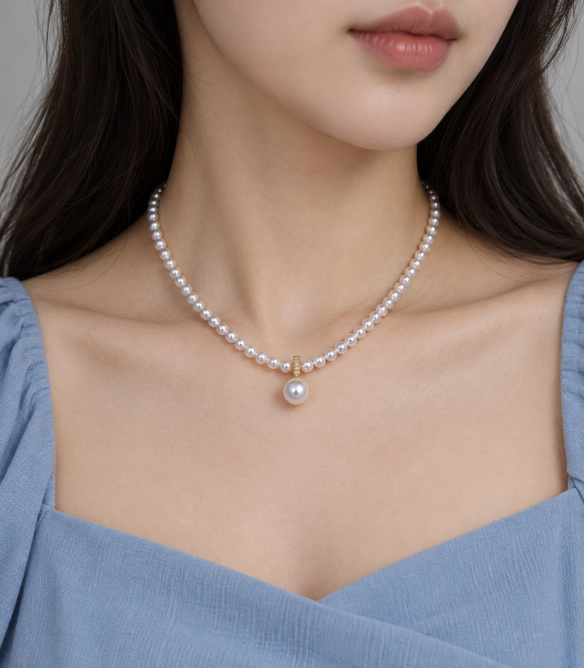 JIMIKI Gold-Tone Pavé Bail Pearl Drop Necklace in Gold-tone, close-up of the pendant and pearl-style strand