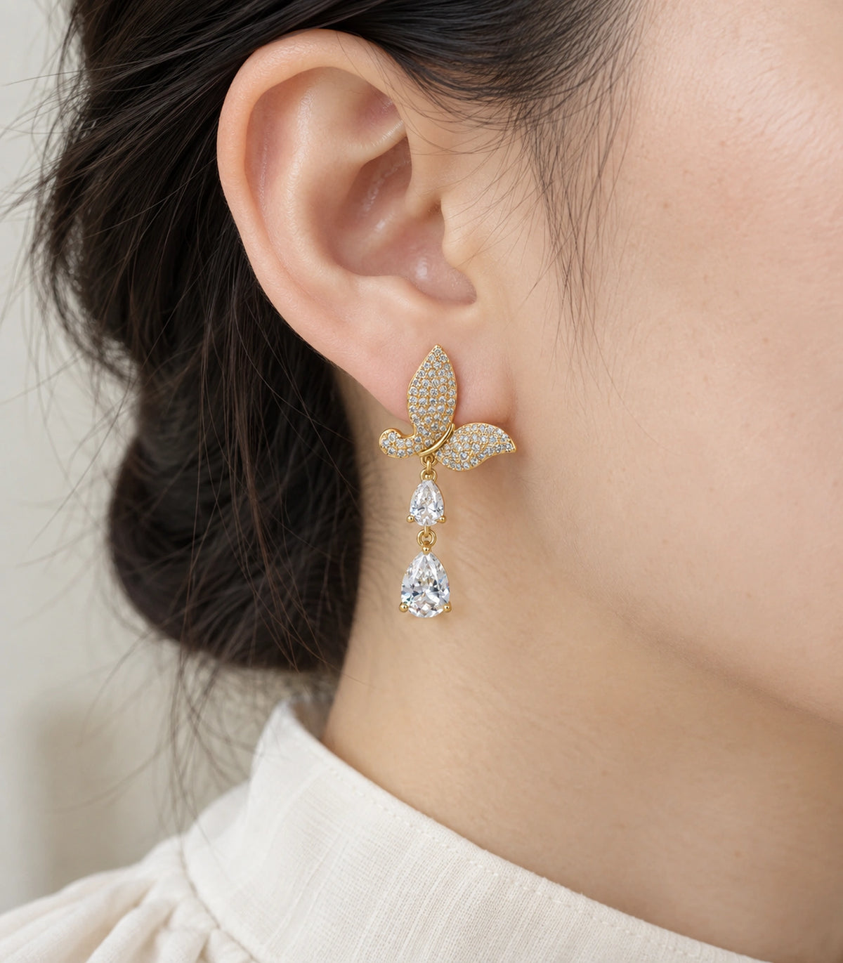 JIMIKI Pave Butterfly Double Teardrop Earring Pair in Gold-tone, close-up detail #color_gold-tone