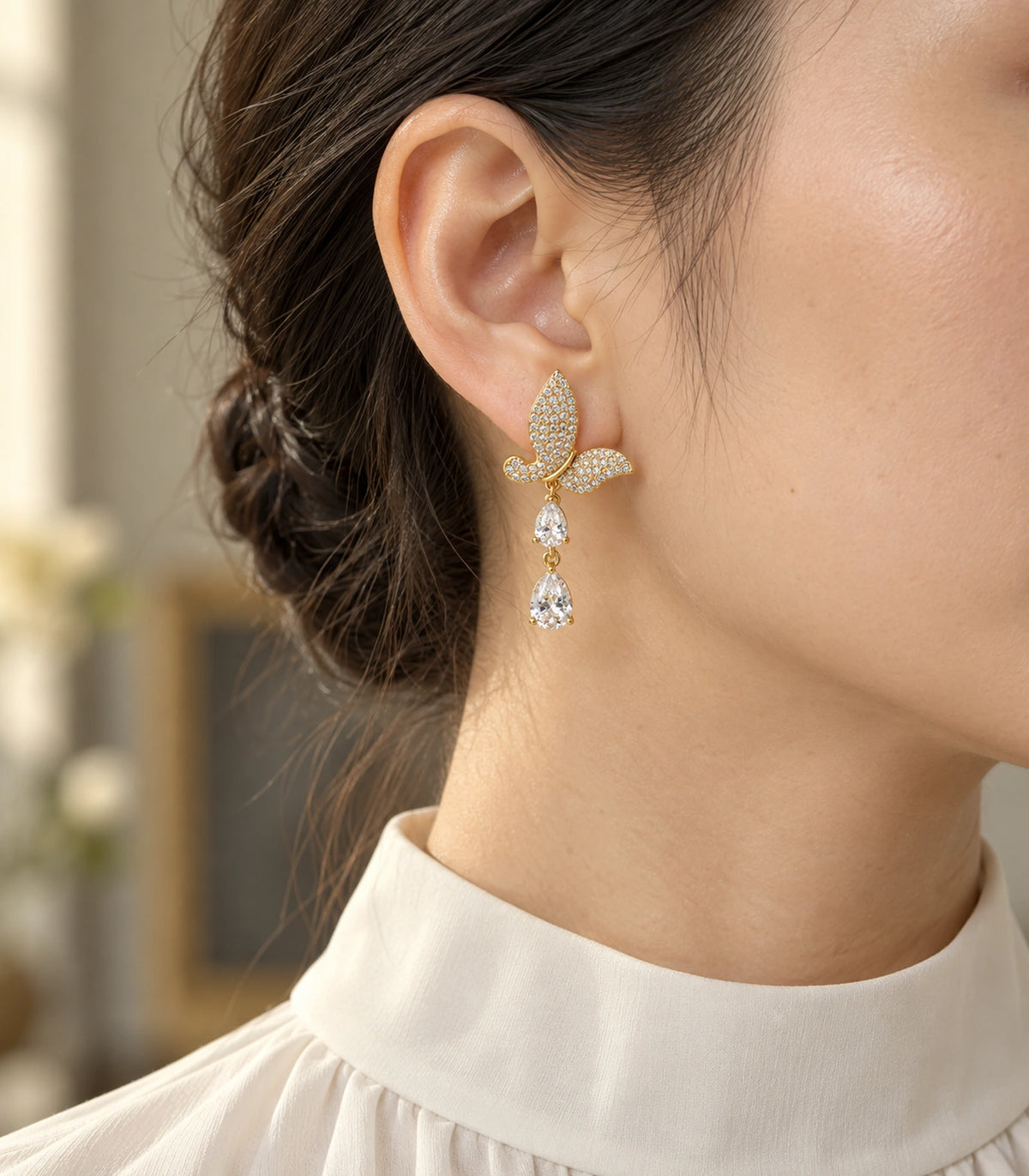 JIMIKI Pave Butterfly Double Teardrop Earring Pair in Gold-tone, editorial model view #color_gold-tone