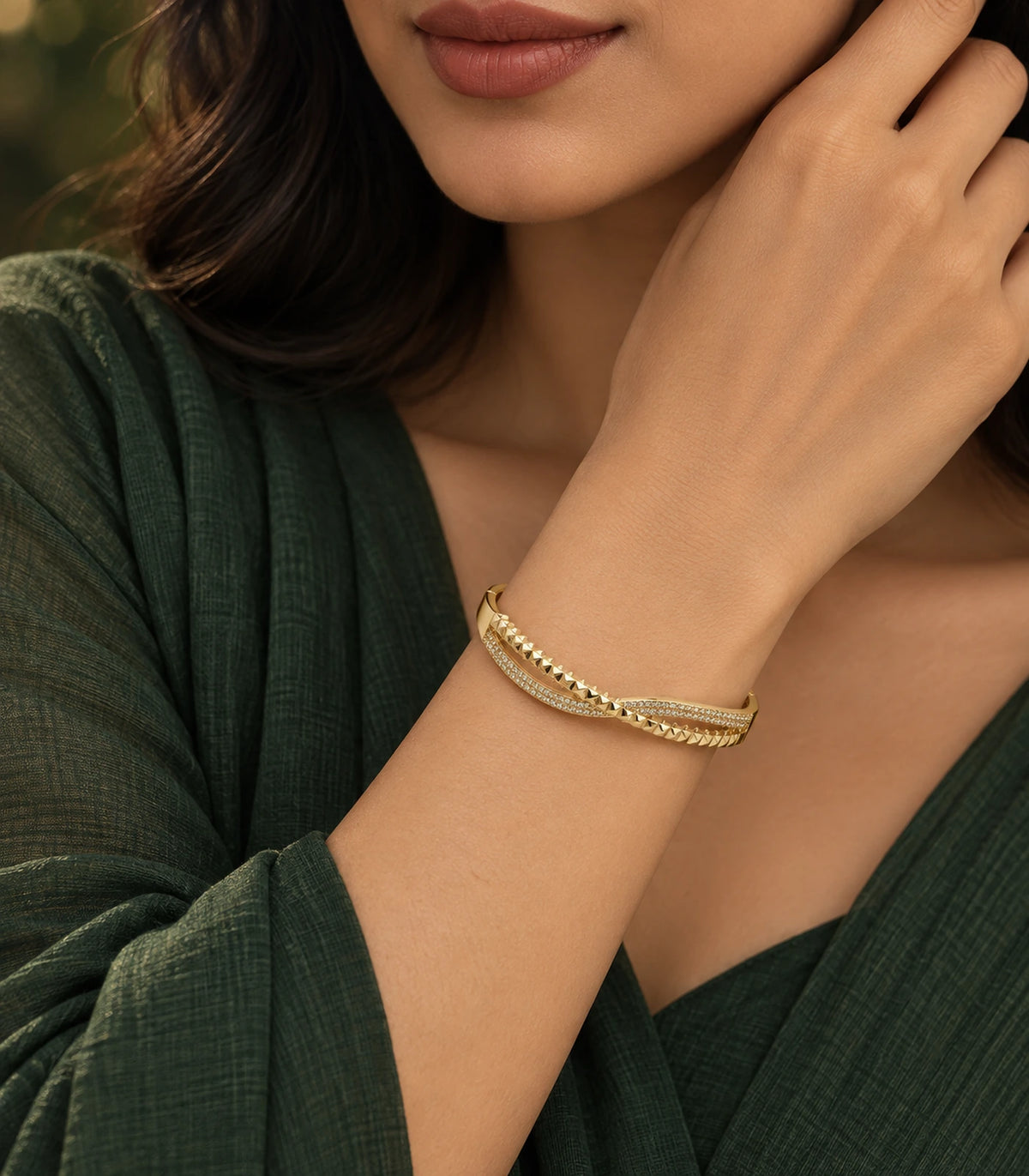 JIMIKI Gold-Tone Pavé Pyramid Crossover Bangle — bangle styled with an outfit #color_gold-tone / clear