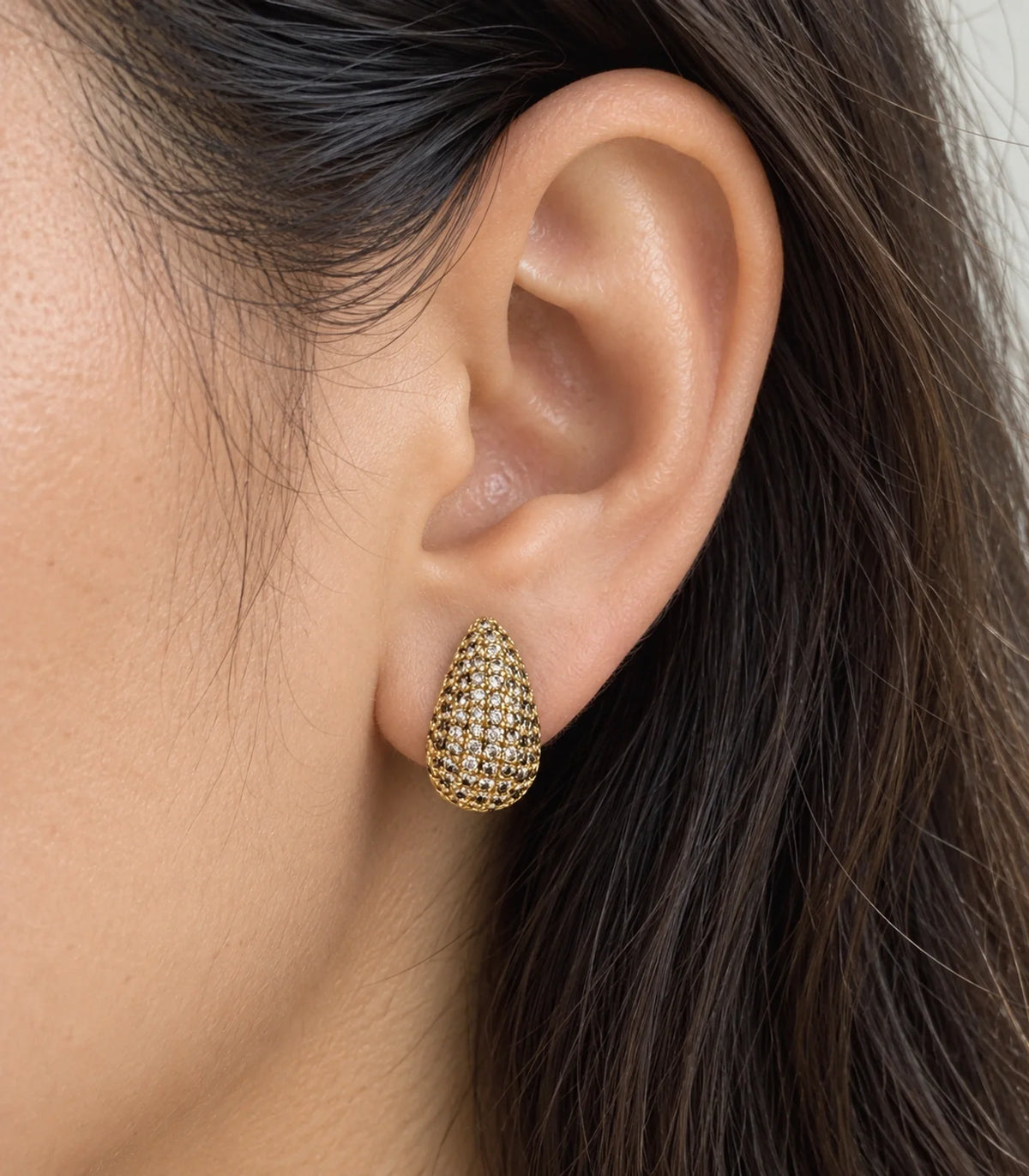 JIMIKI Gold Tone Pave Teardrop Stud Earrings - worn close-up showing earring detail #color_gold-tone