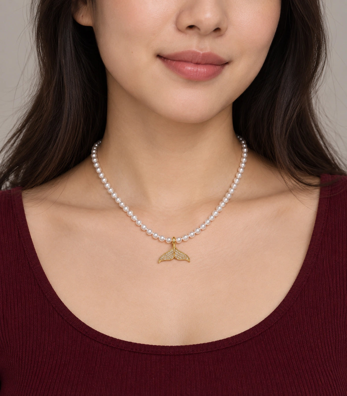 JIMIKI Pavé Whale Tail Pearl Necklace in Gold-tone, worn with a simple outfit #color_gold-tone