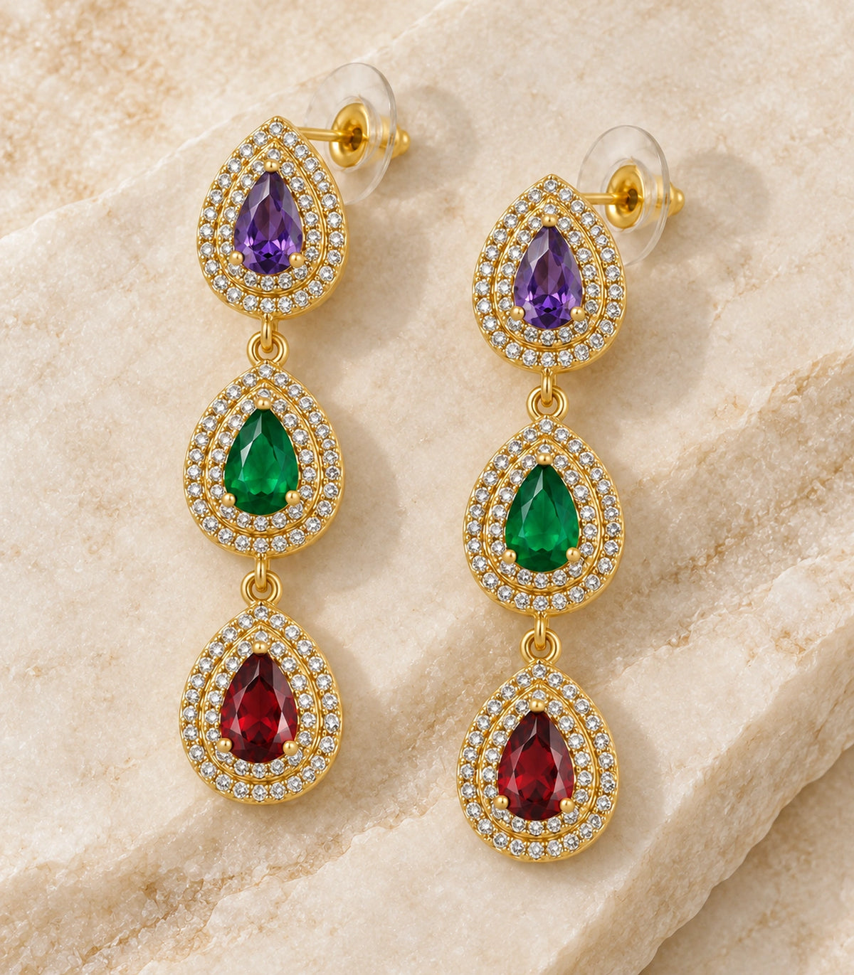 JIMIKI Gold-Tone Purple Green Red Triple-Teardrop Halo Earrings in Gold Tone / Purple, Green & Red, editorial flat lay