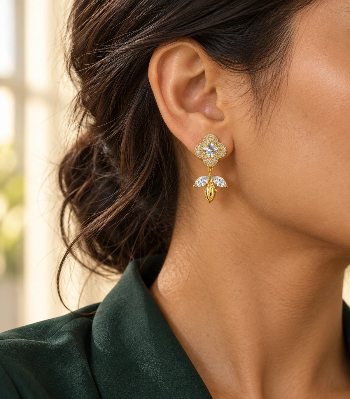 JIMIKI Quatrefoil Crystal Leaf Drop Earring Pair in Gold Tone, editorial model view #color_gold tone