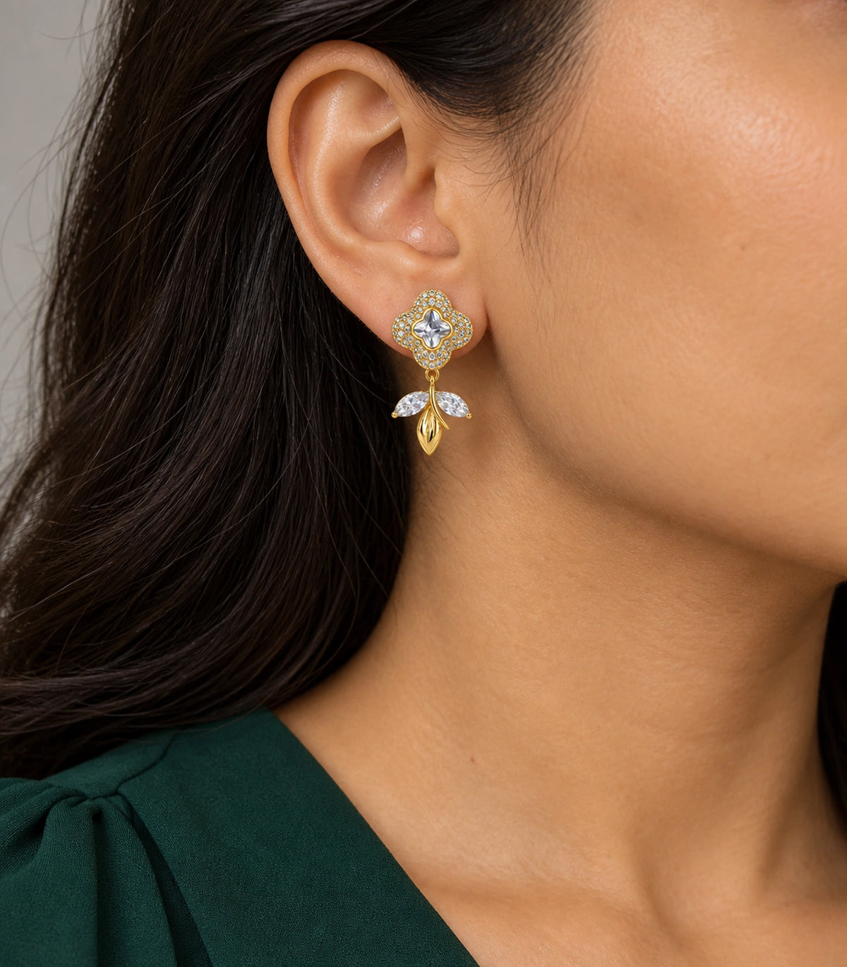 JIMIKI Quatrefoil Crystal Leaf Drop Earring Pair in Gold Tone, model wearing view #color_gold tone