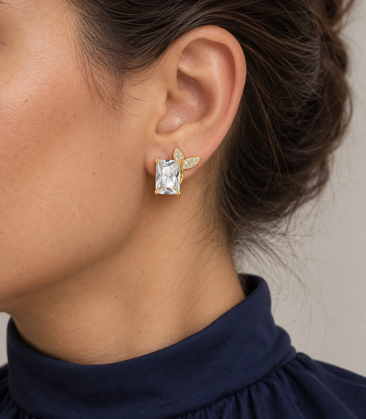 JIMIKI Rectangular Crystal Twin Leaf Stud Earring Pair in Gold-tone, close-up detail #color_gold-tone