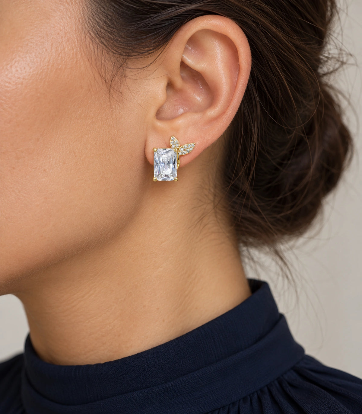 JIMIKI Rectangular Crystal Twin Leaf Stud Earring Pair in Gold-tone, model wearing view #color_gold-tone