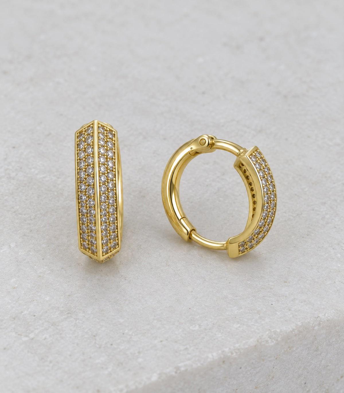 JIMIKI ridged pave hinged hoop earring pair in gold tone, editorial flat lay #color_gold tone