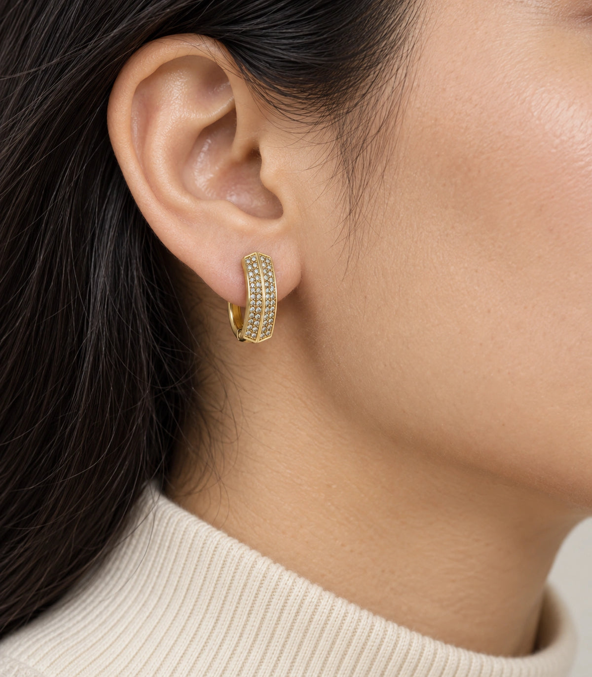 JIMIKI ridged pave hinged hoop earring pair in gold tone, worn on a model #color_gold tone