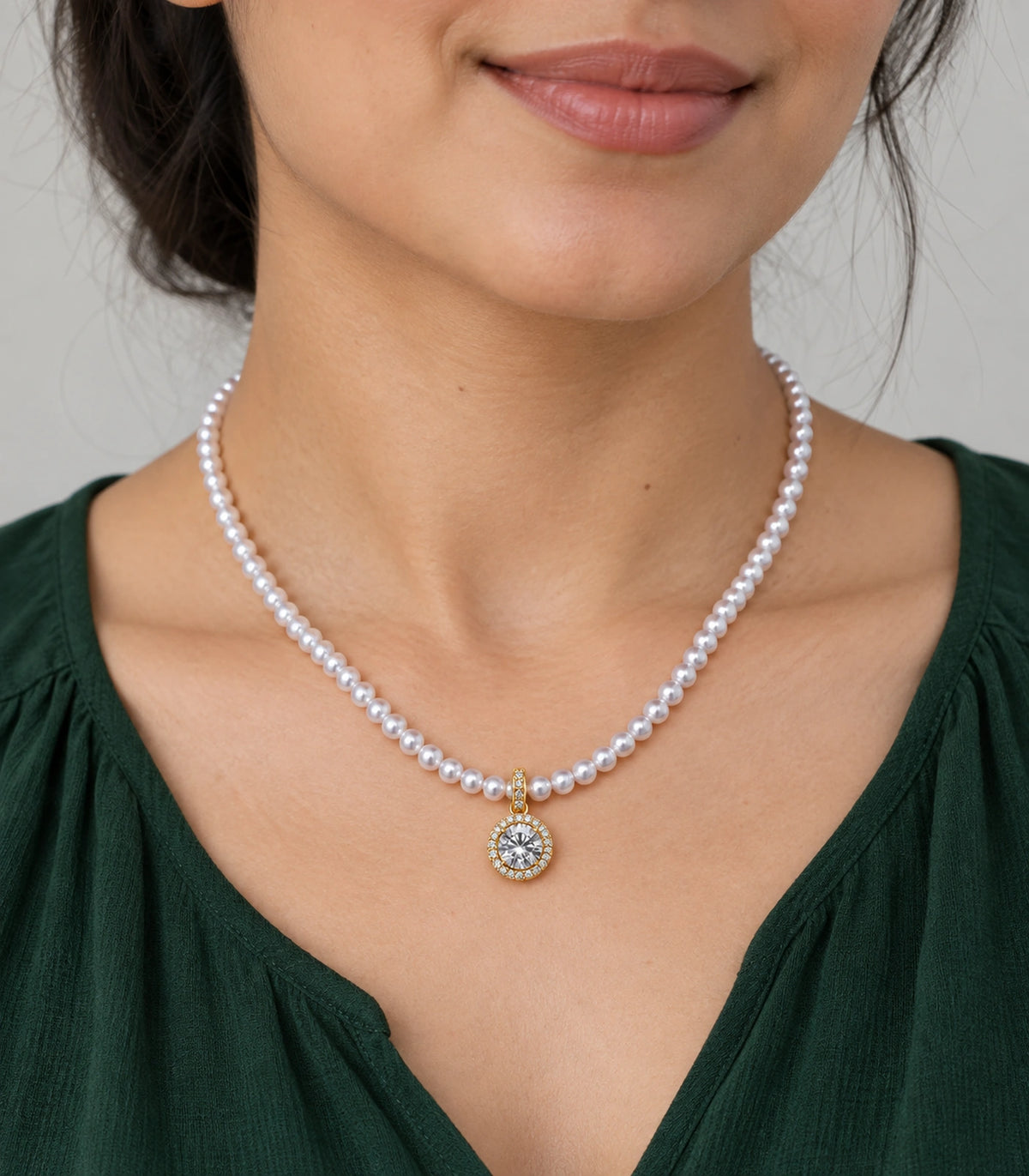 JIMIKI Gold Tone Round Halo Crystal Pearl Style Necklace in Gold tone / white, model wearing view