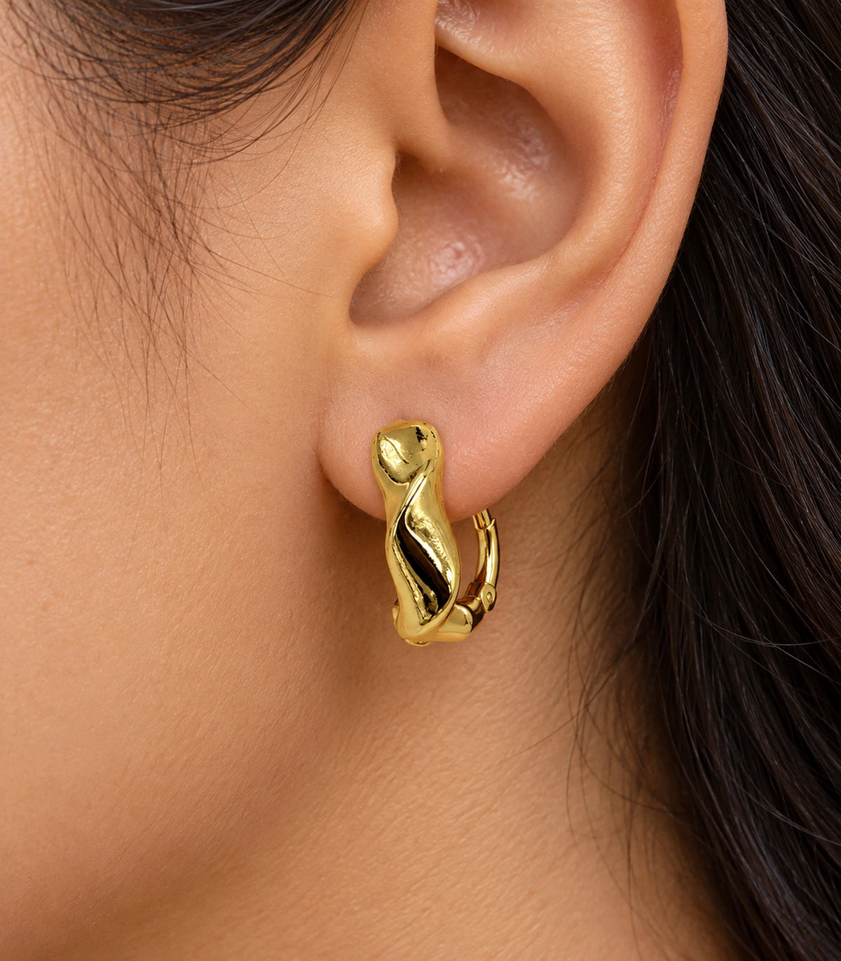 JIMIKI Gold Tone Sculpted Twist Hoop Earrings in Gold Tone - closeup #color_gold-tone
