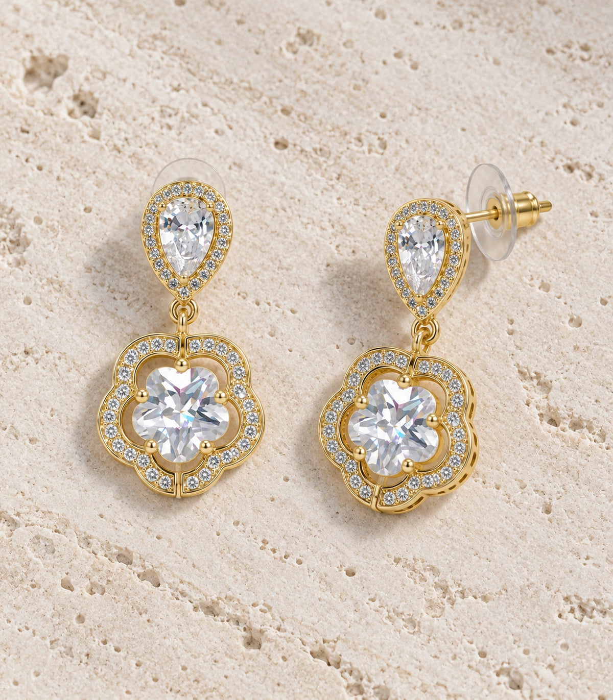 JIMIKI Teardrop Flower Crystal Drop Earring Pair in Gold-tone, editorial flat lay #color_gold-tone