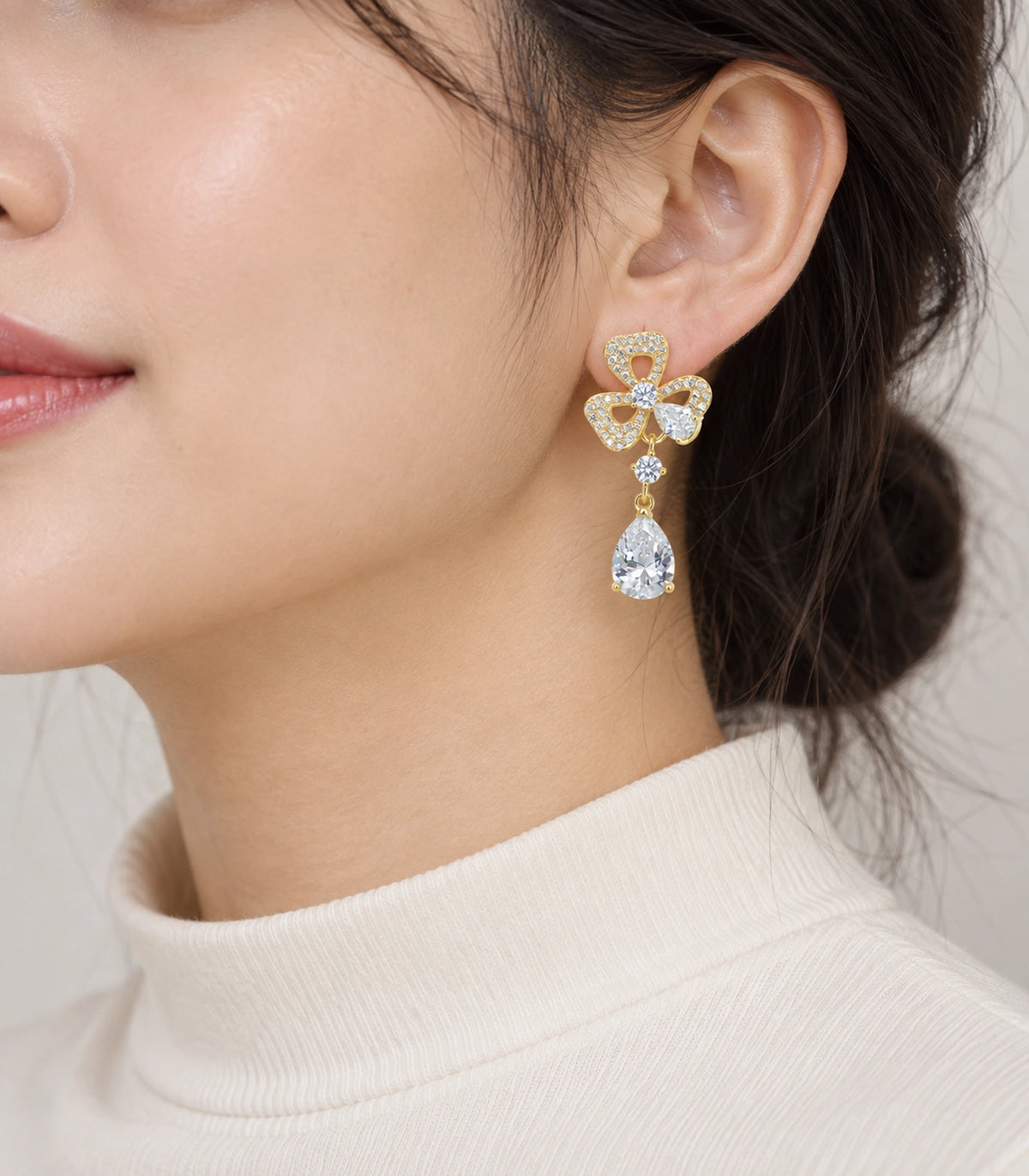 JIMIKI Gold-Tone Three-Loop Crystal Flower Pear Drop Earrings in Gold Tone, model wearing view