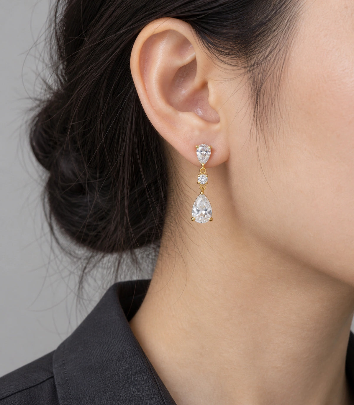 JIMIKI Gold Tone Three Stone Pear Drop Earring Pair in Gold-tone, model wearing view