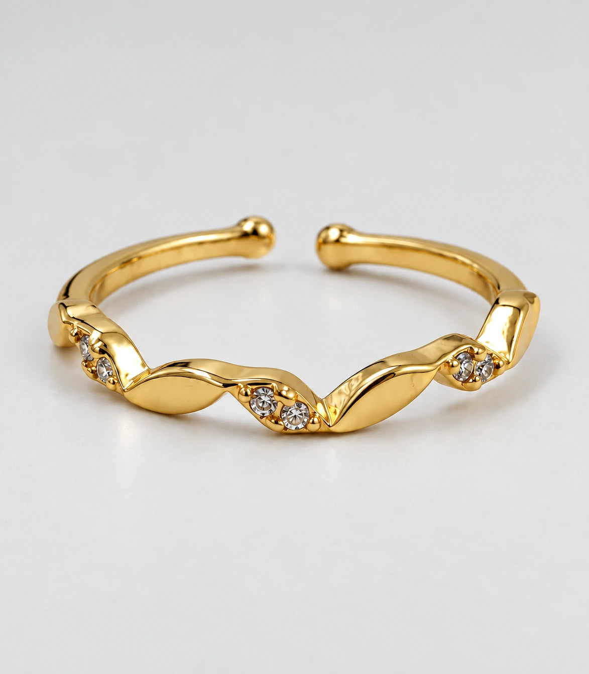 JIMIKI Gold Tone Twisted Leaf Crystal Adjustable Ring in Gold Tone - close-up details #color_gold-tone
