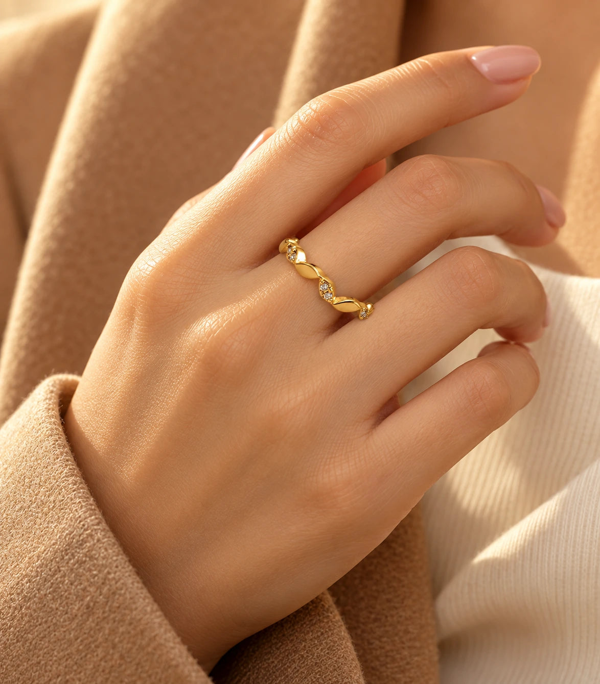 JIMIKI Gold Tone Twisted Leaf Crystal Adjustable Ring in Gold Tone - editorial worn view #color_gold-tone