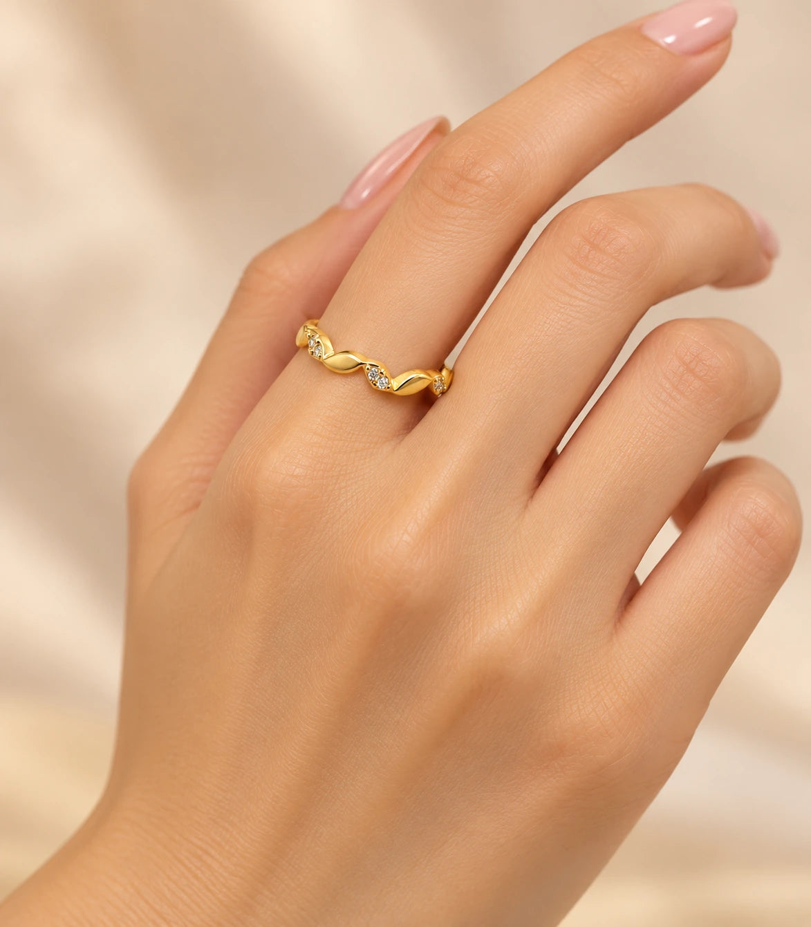 JIMIKI Gold Tone Twisted Leaf Crystal Adjustable Ring in Gold Tone - worn styling view #color_gold-tone