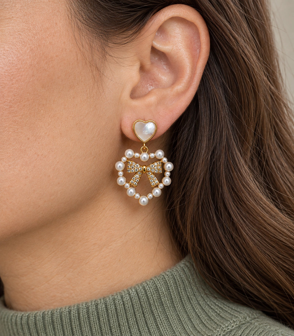 JIMIKI Heart Pearl Bow Drop Earring Pair in Gold Tone / White, close-up detail #color_gold tone / white