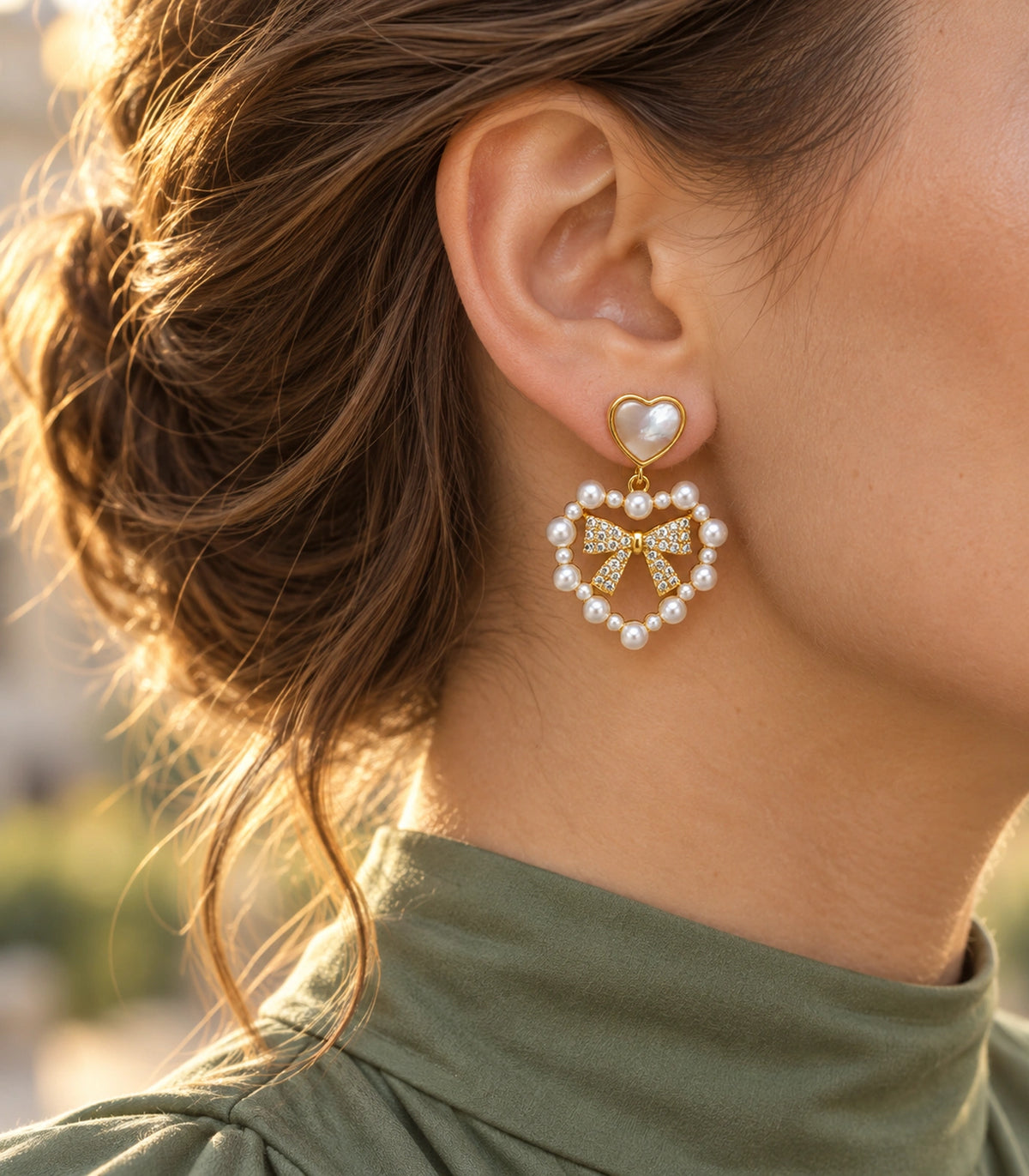 JIMIKI Heart Pearl Bow Drop Earring Pair in Gold Tone / White, editorial model view #color_gold tone / white