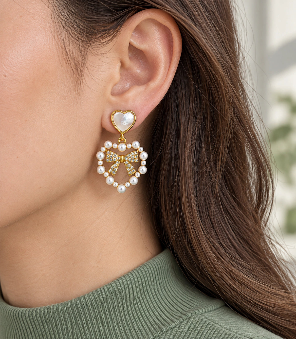 JIMIKI Heart Pearl Bow Drop Earring Pair in Gold Tone / White, model wearing view #color_gold tone / white