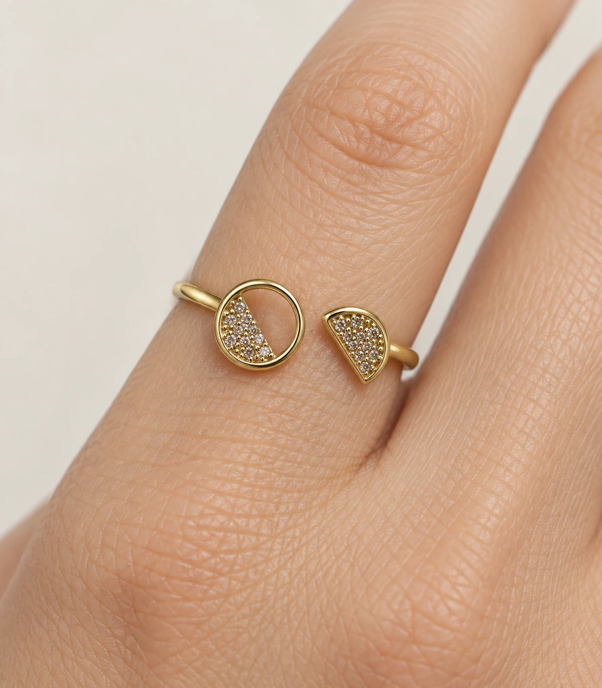 Close view of the Gold Two-Shape Pavé Open Ring on a finger
