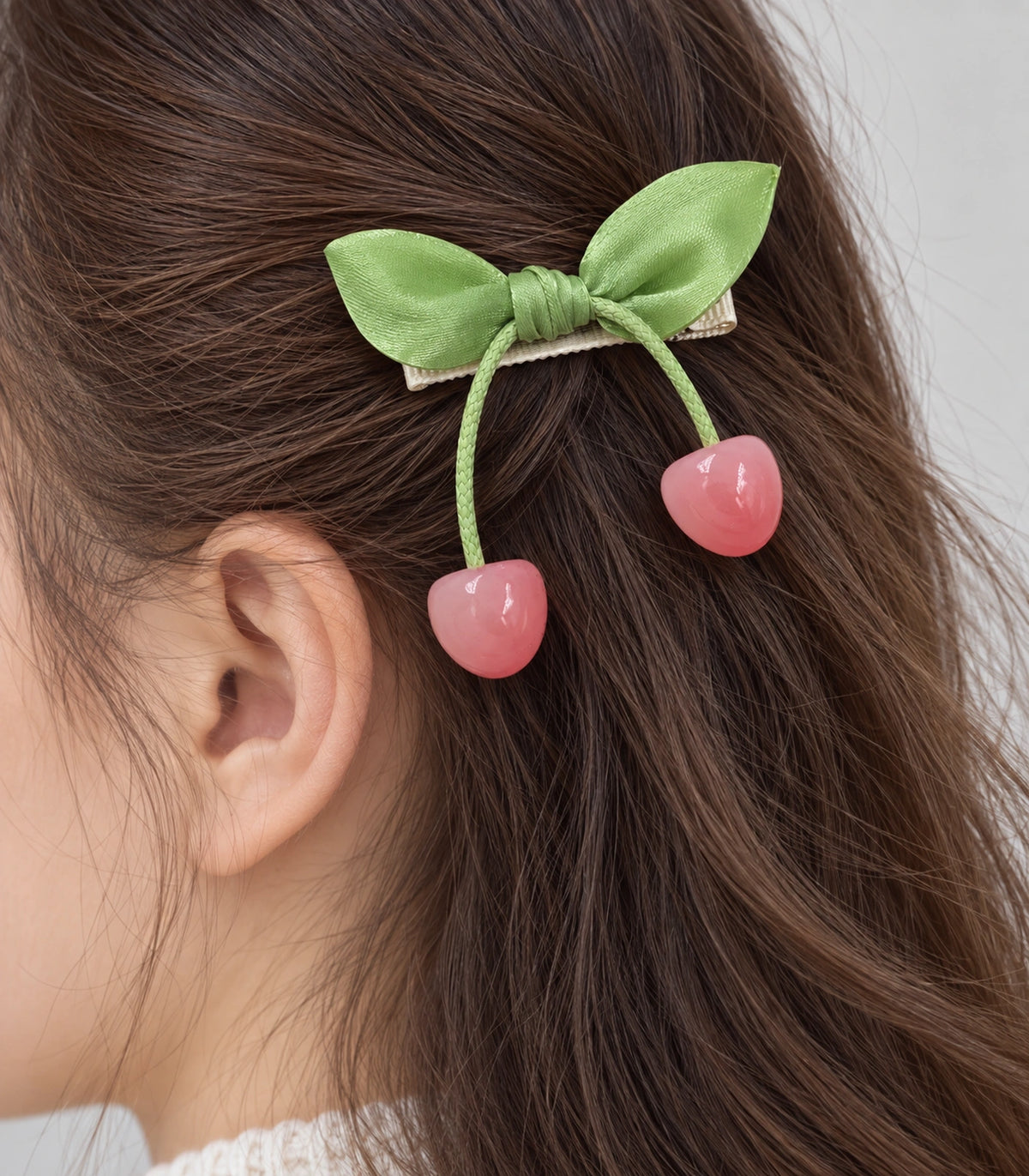 JIMIKI Green Leaf Bow Hair Clip with Cherry Charms in Green, close-up detail