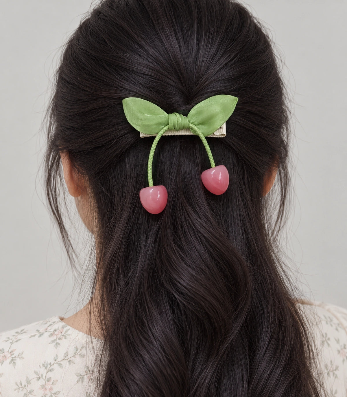 JIMIKI Green Leaf Bow Hair Clip with Cherry Charms in Green, model wearing view