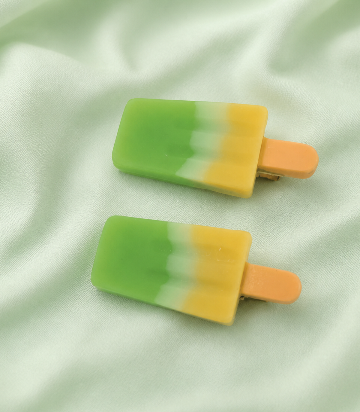 Green Yellow Popsicle Clip Pair in an editorial flat lay
