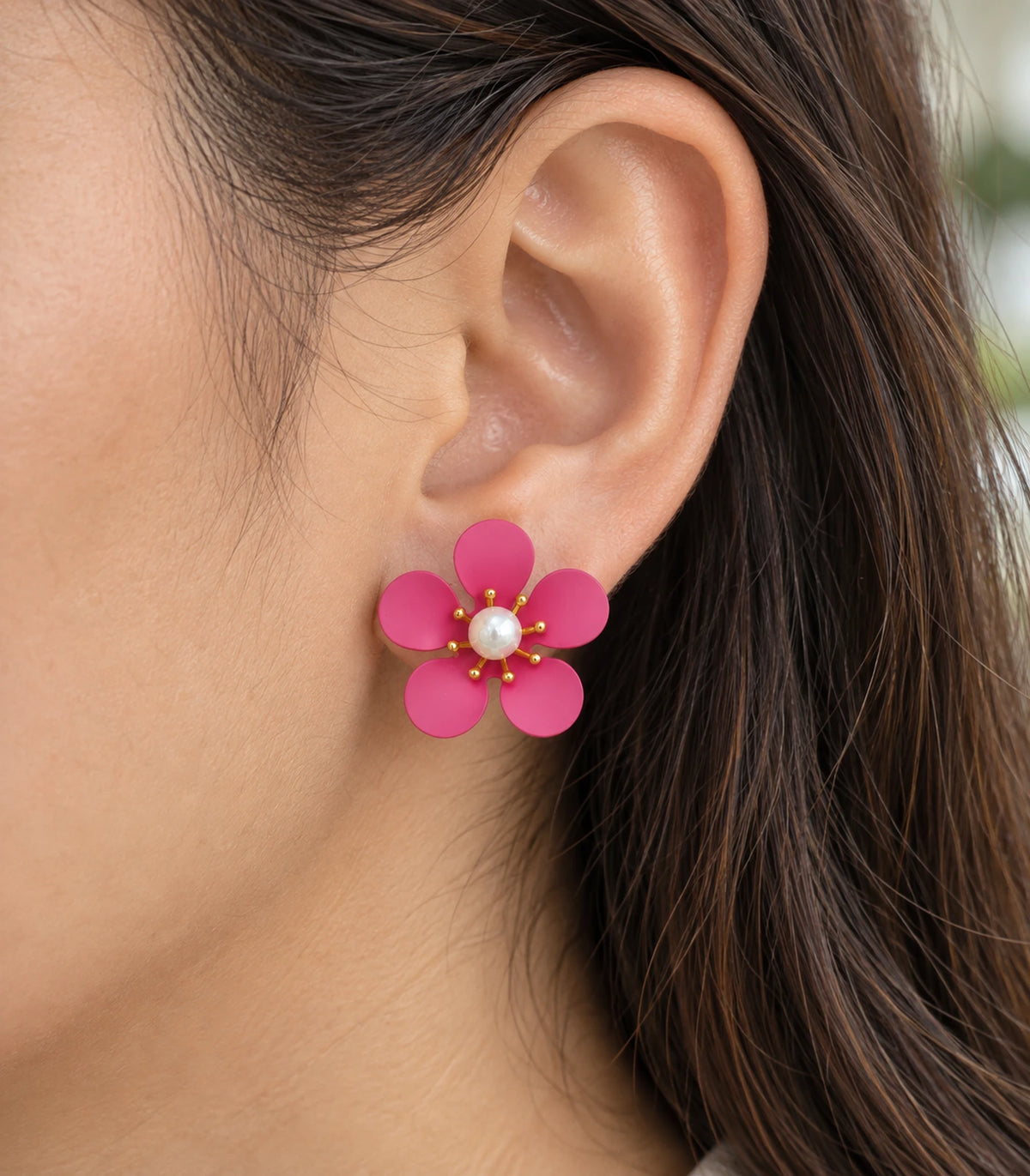 JIMIKI hot pink five-petal flower stud earrings with pearl-effect centre, closeup of flower stud in a natural worn setting #color_hot-pink