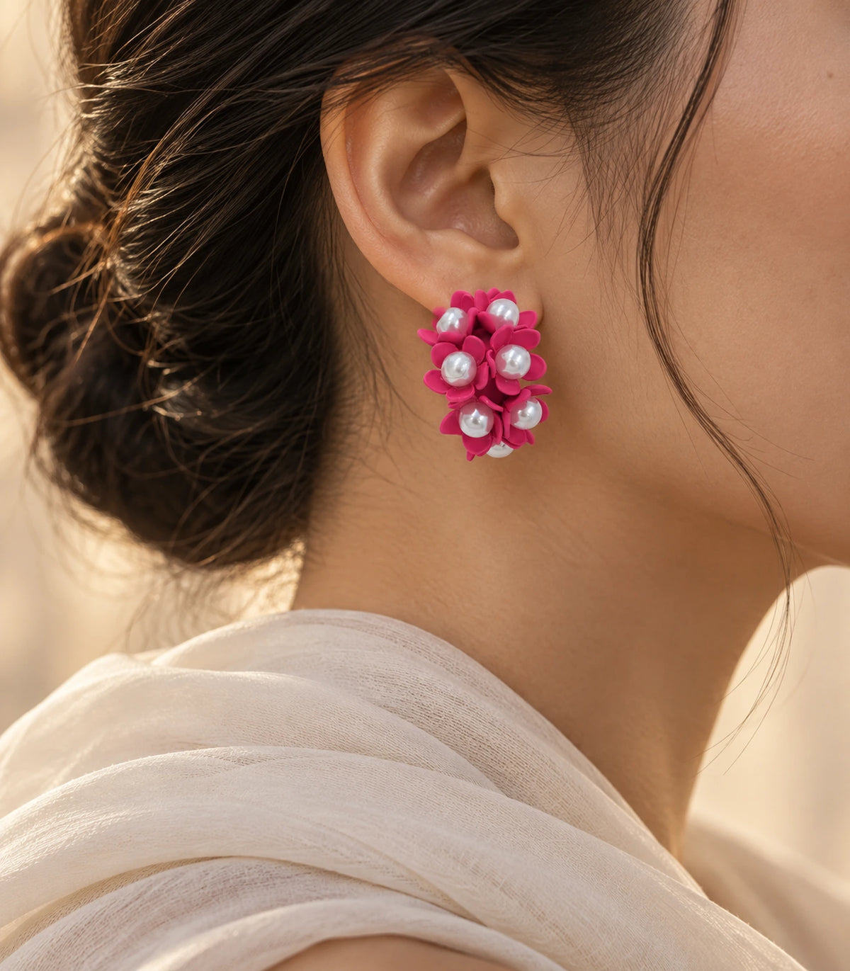 JIMIKI Hot Pink pearl flower hoop earrings, worn with softly lit editorial styling #color_hot pink