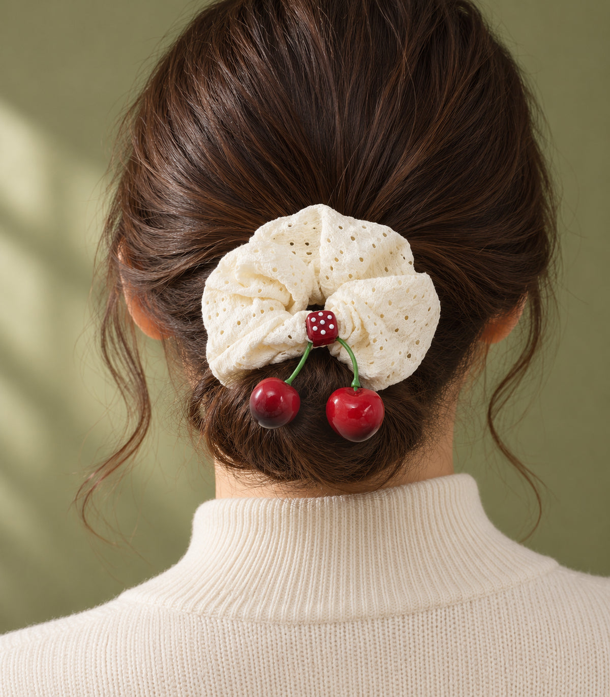 Ivory eyelet cherry scrunchie with dotted square centre, editorial model