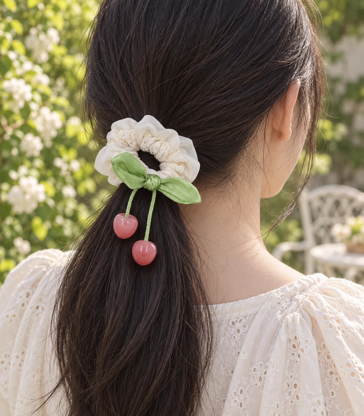 JIMIKI Lace Scrunchie With Cherry Charms in Ivory, editorial model view #color_ivory