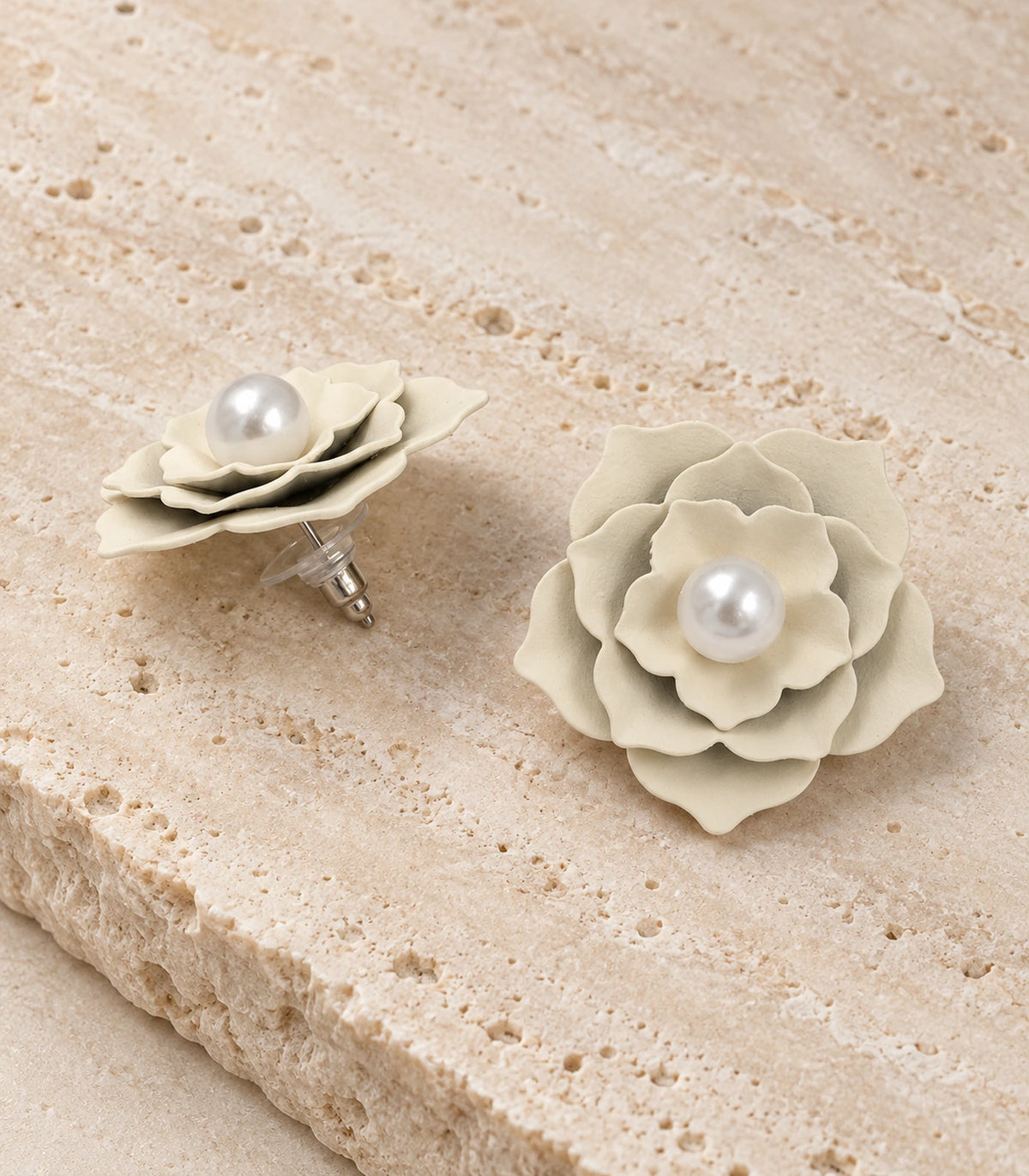 JIMIKI Layered Flower Pearl Stud Earrings, Ivory — pair in a styled flat lay #color_ivory