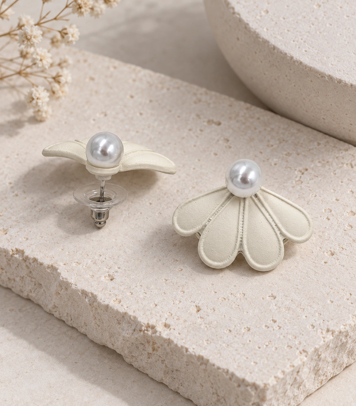 JIMIKI Ivory pearl fan petal stud earrings, pair in an editorial flat lay #color_ivory