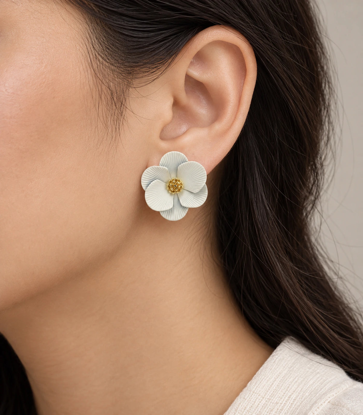 JIMIKI Ivory ribbed flower stud earrings, worn view showing the flower stud #color_ivory