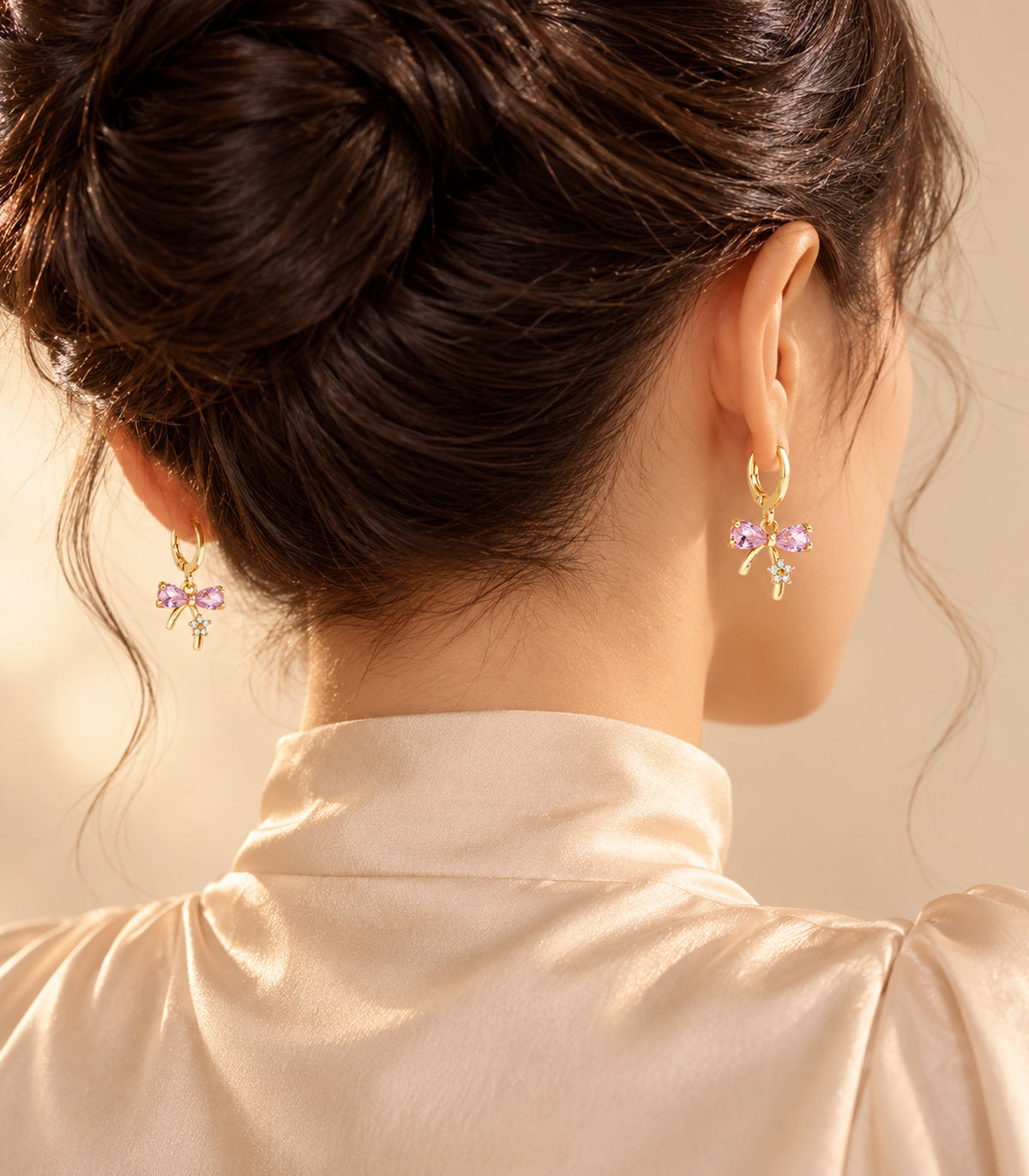 Gold-tone charm hoop earrings in an editorial wearing view