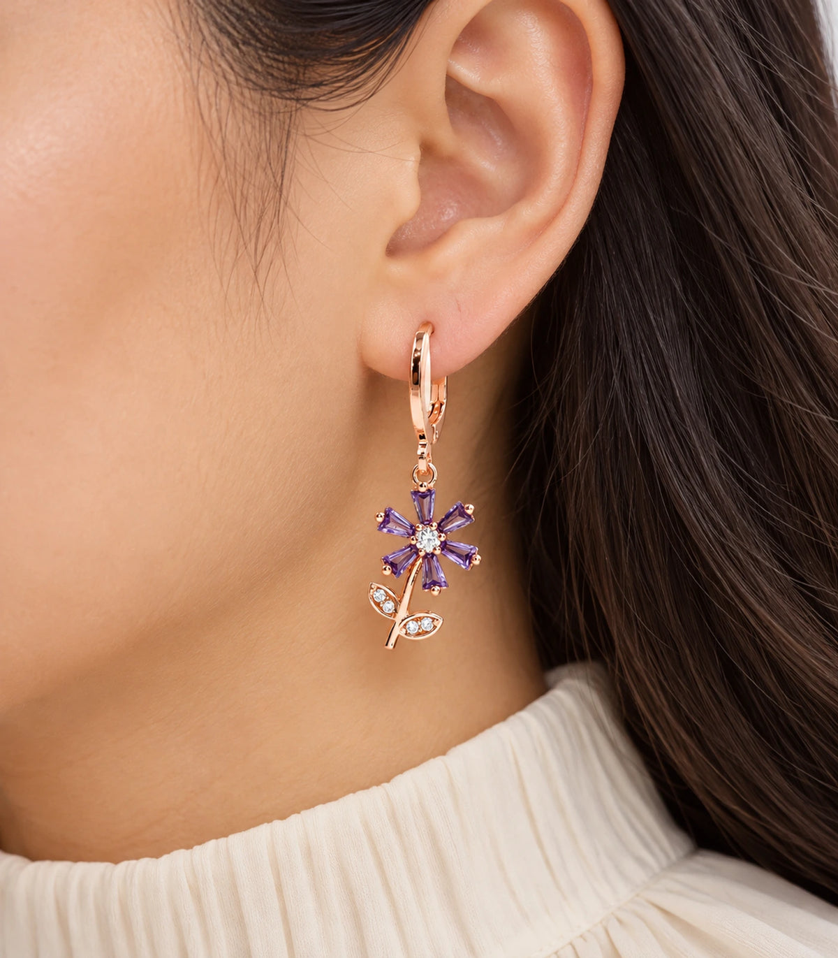 JIMIKI rose gold tone three-pair ball, crystal and purple flower hoop earring set — closeup