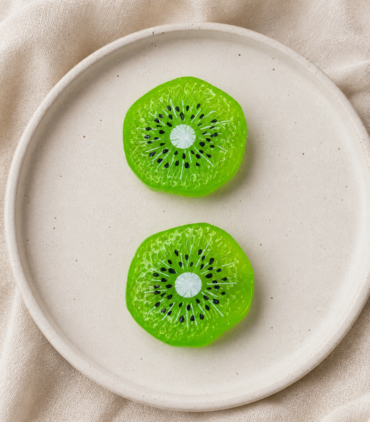 Kiwi Slice Barrette Pair editorial flat lay