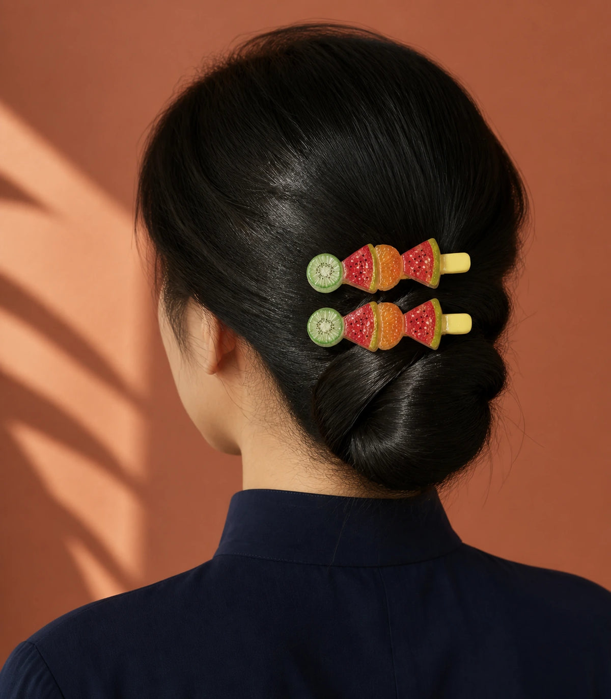 Editorial model view of the Kiwi Watermelon Orange Fruit Barrette Pair