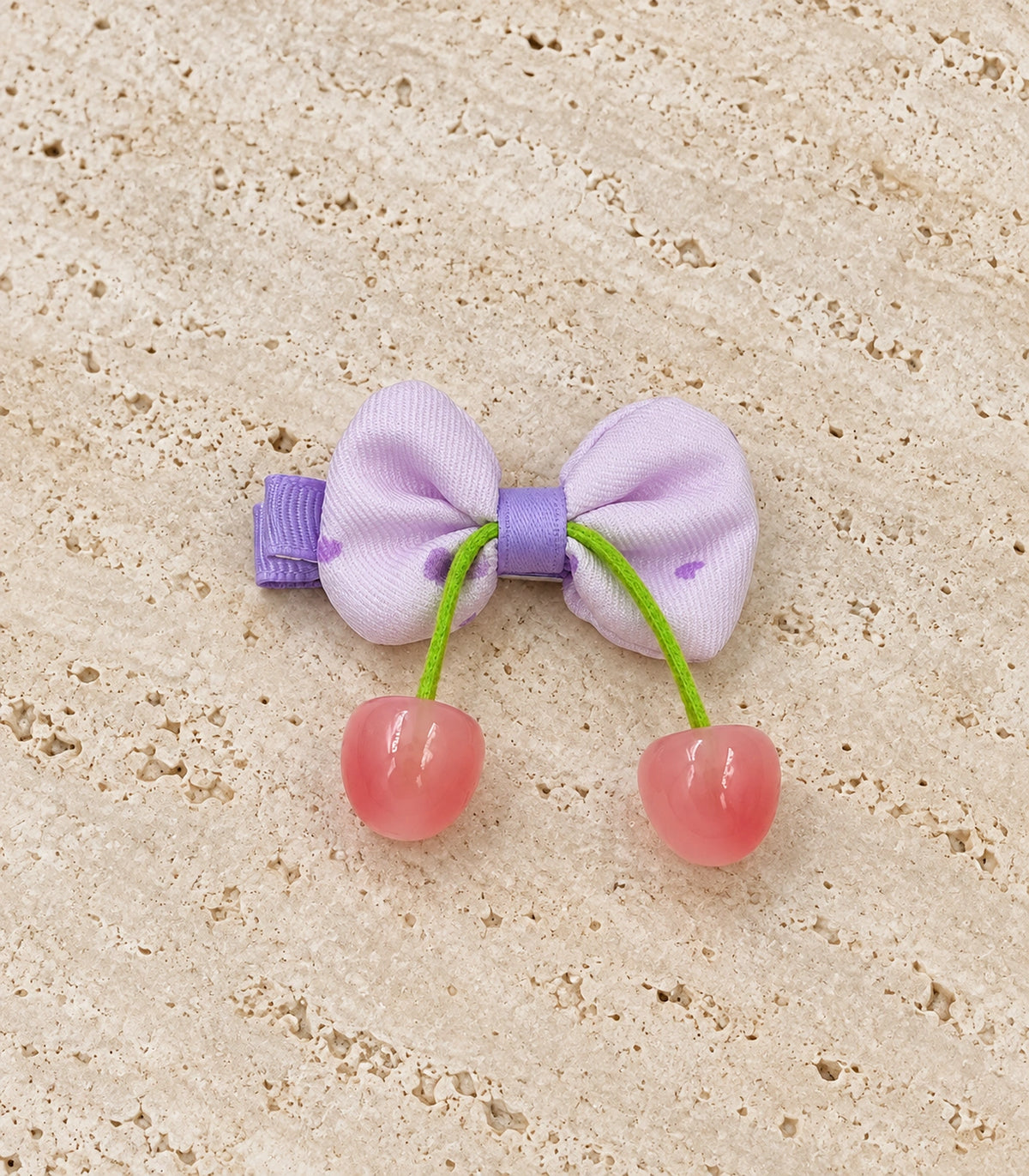 JIMIKI Lavender Bow Hair Clip with Cherry Charms in Lavender, editorial flat lay