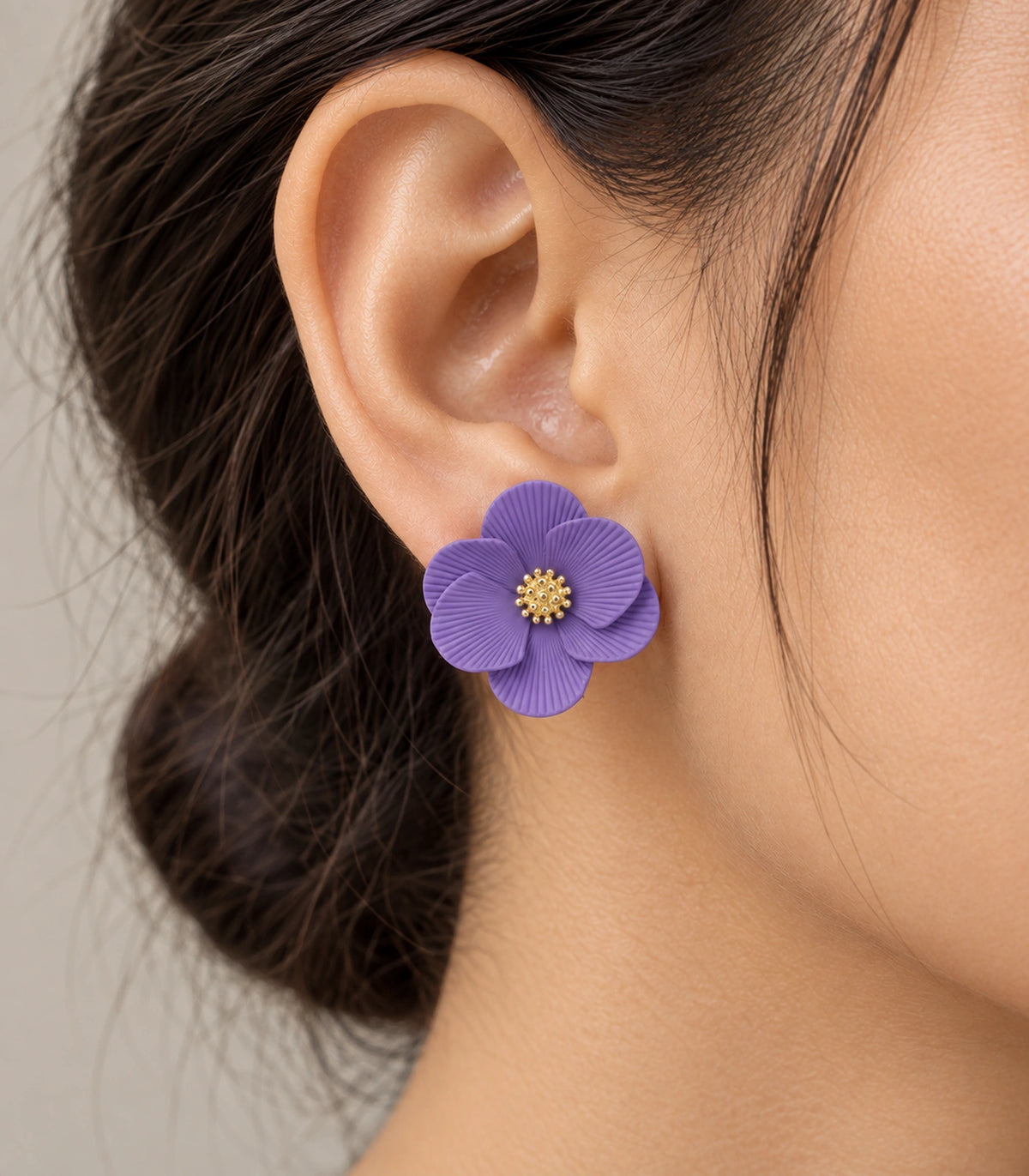 JIMIKI Lavender ribbed flower stud earrings, worn closeup of ribbed petals and gold-tone centre #color_lavender